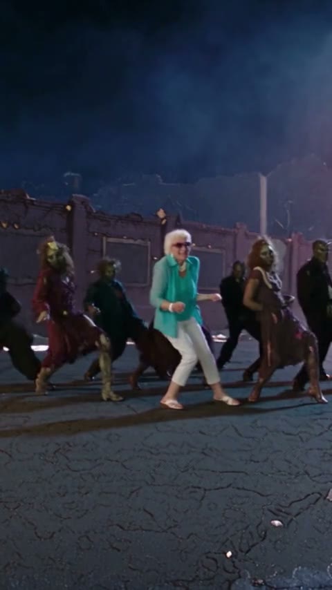 Sample 2: a grandmother in a teal top leads the zombie dance